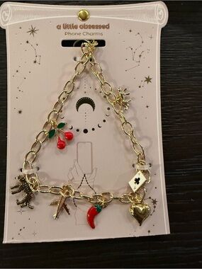 A Little Obsessed Gold Charm Bracelet with Red Enamel Charms